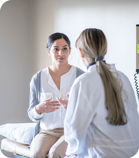 doctor talking to female patient