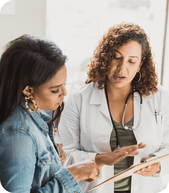 doctor and patient talking and looking at a chart
